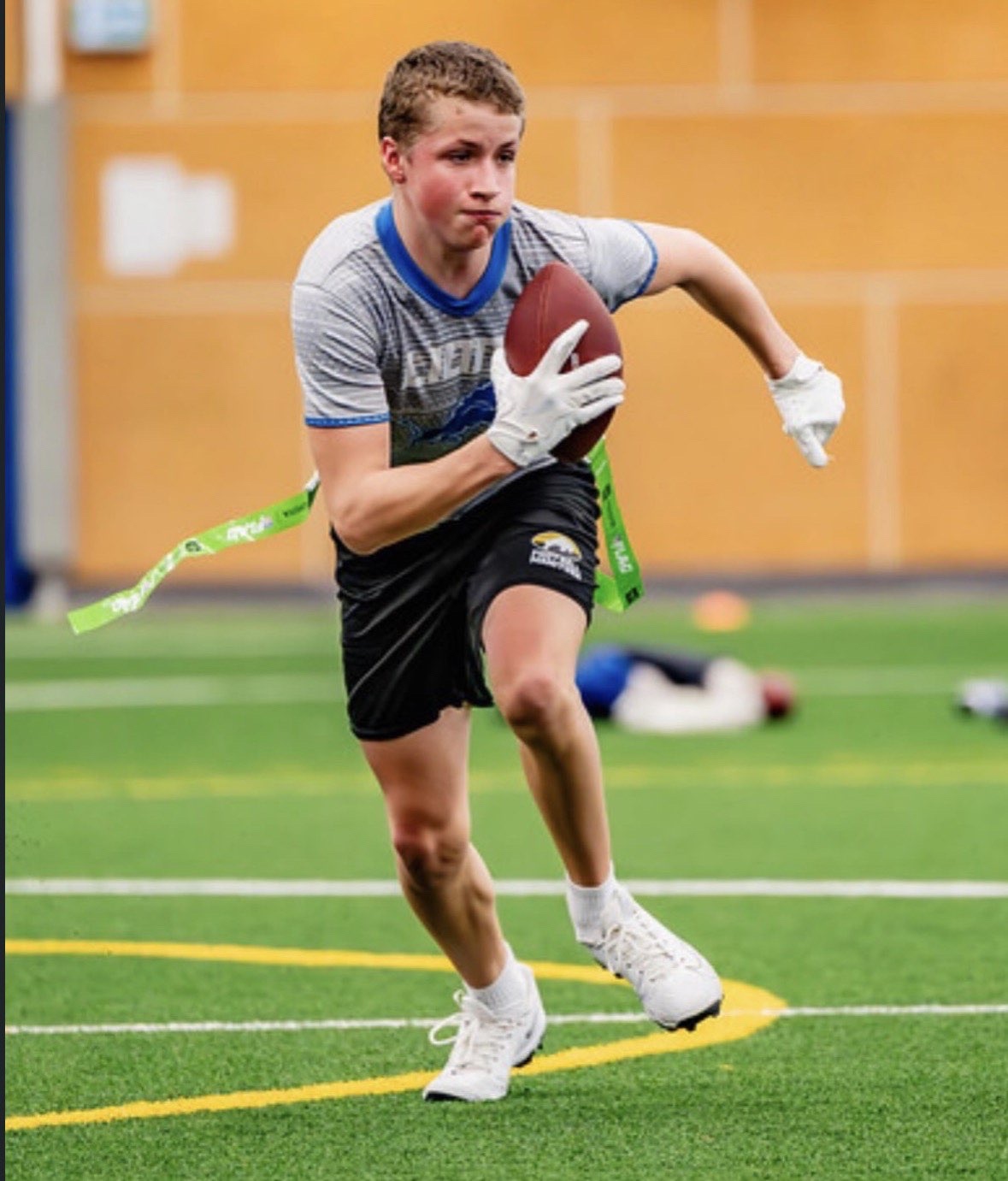 Royals running back carrying the football at full speed
